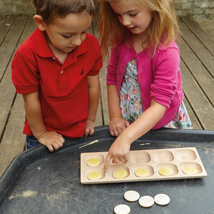 Two children playing with maths activity set