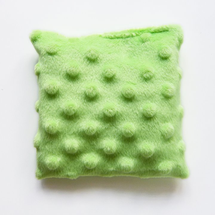 Green bumpy cushion