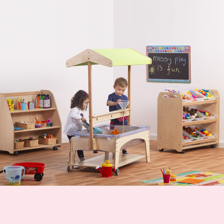 2 children playing with messy play zone