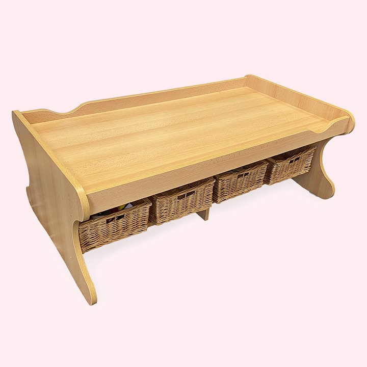 Wooden lipped play table with wicker baskets under storage