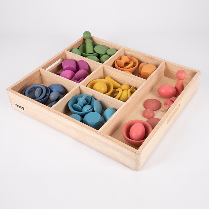 Box with Tactile smooth solid beechwood loose parts in the seven colours of the rainbow