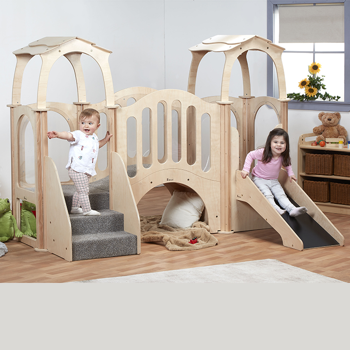 Two children playing on kinder gym