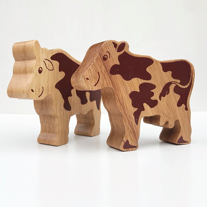 A couple of wooden cows