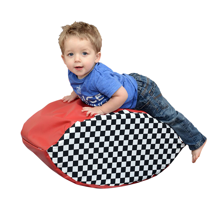 Boy rocking on balancer