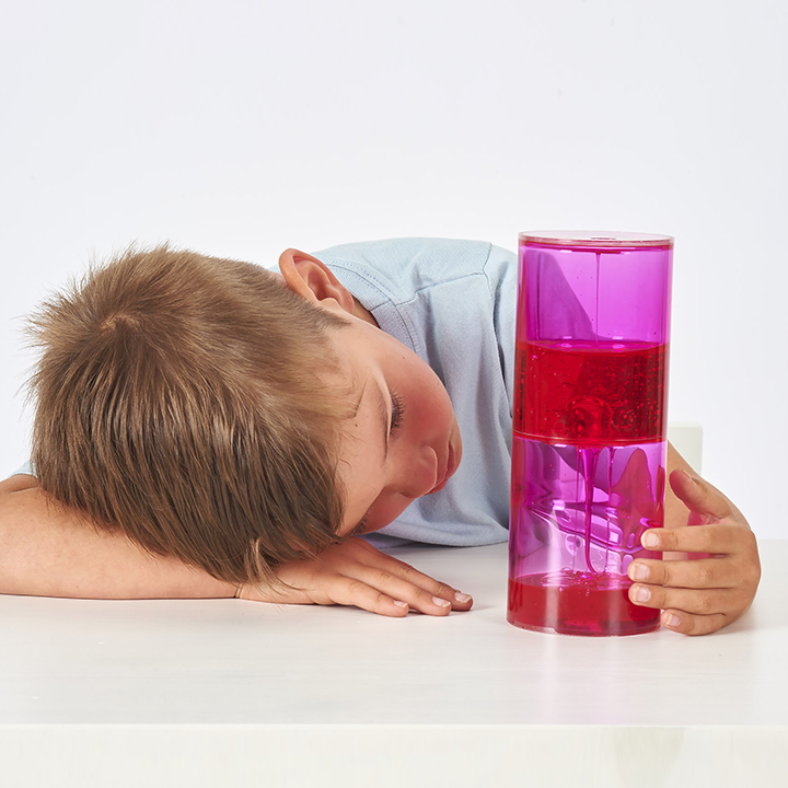 Little boy looking at ooze tube