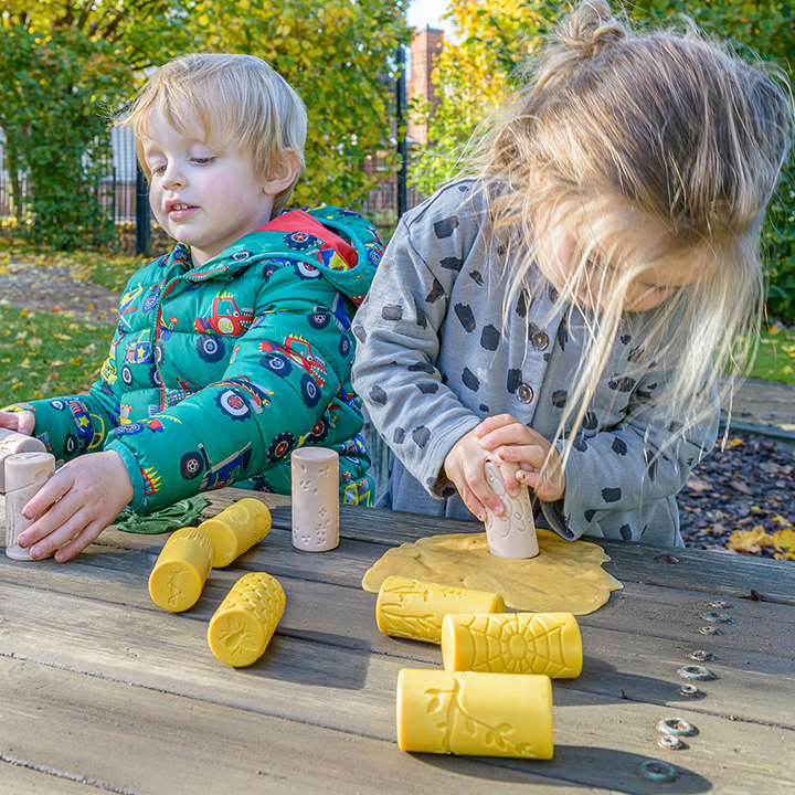 Stamp and roll marks into clay