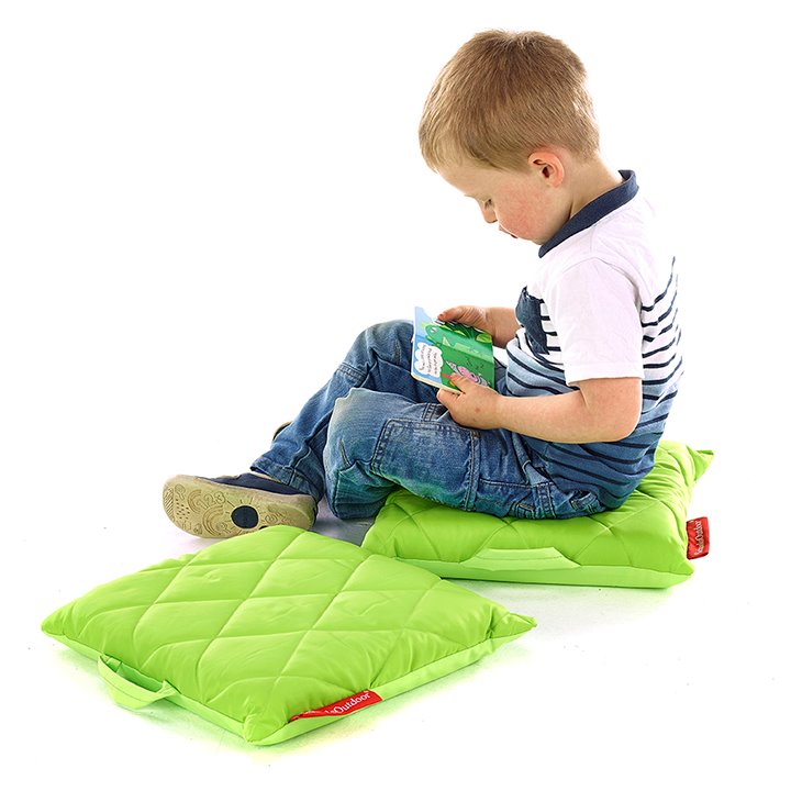 Child on colourful sit mat