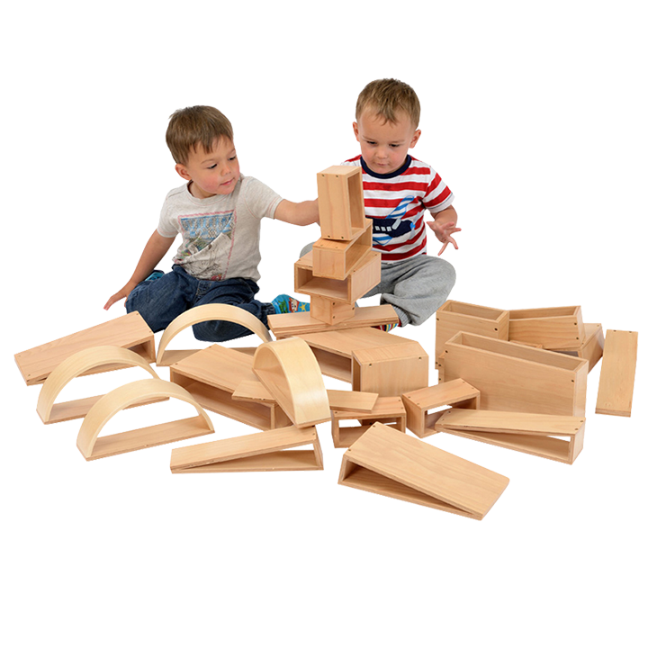 Two children sitting amongst blocks