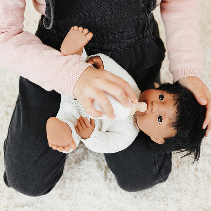 Feeding doll with wooden bottle