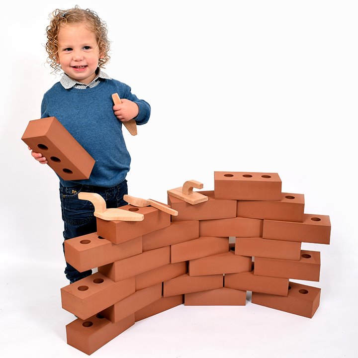 Build a pretend wall with pretend bricks