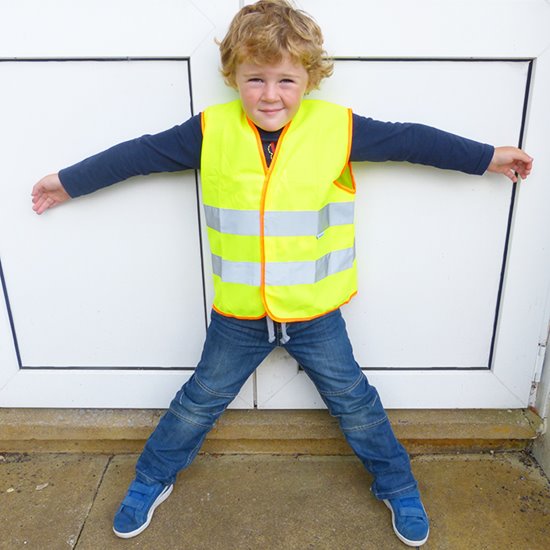 Boy wearing yellow high vis vest