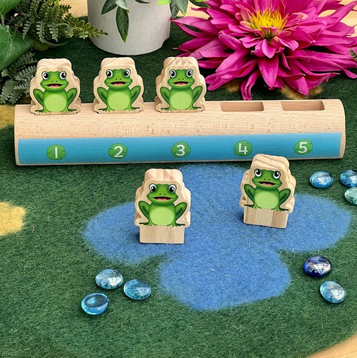 Log with five frogs
