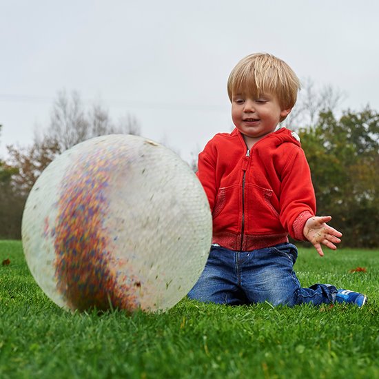 Clear plastic inflatable ball filled with colourful plastic beads