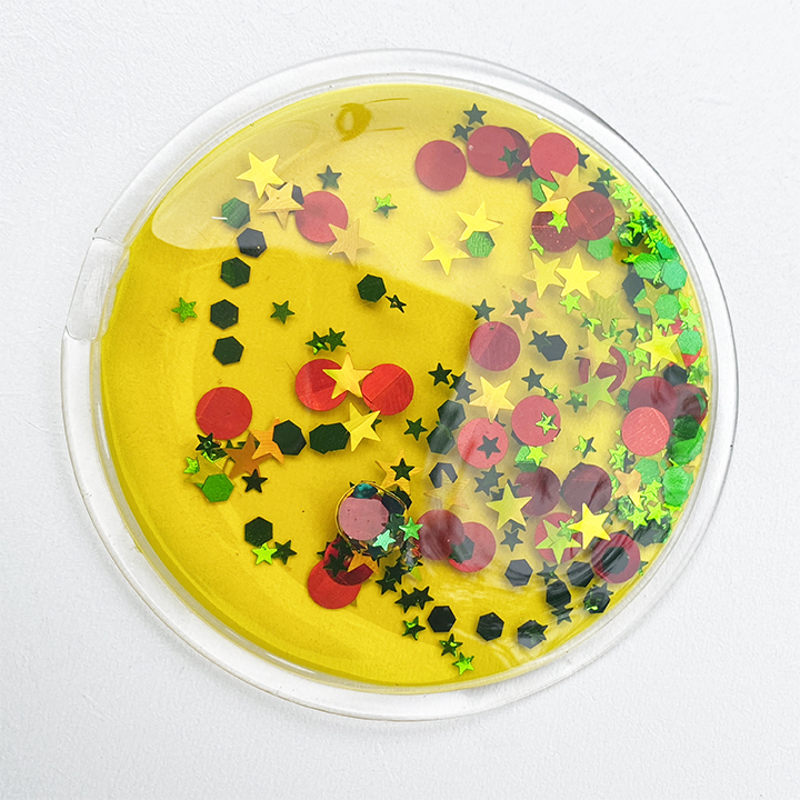 Five liquid filled circles with fascinating stars and shapes inside