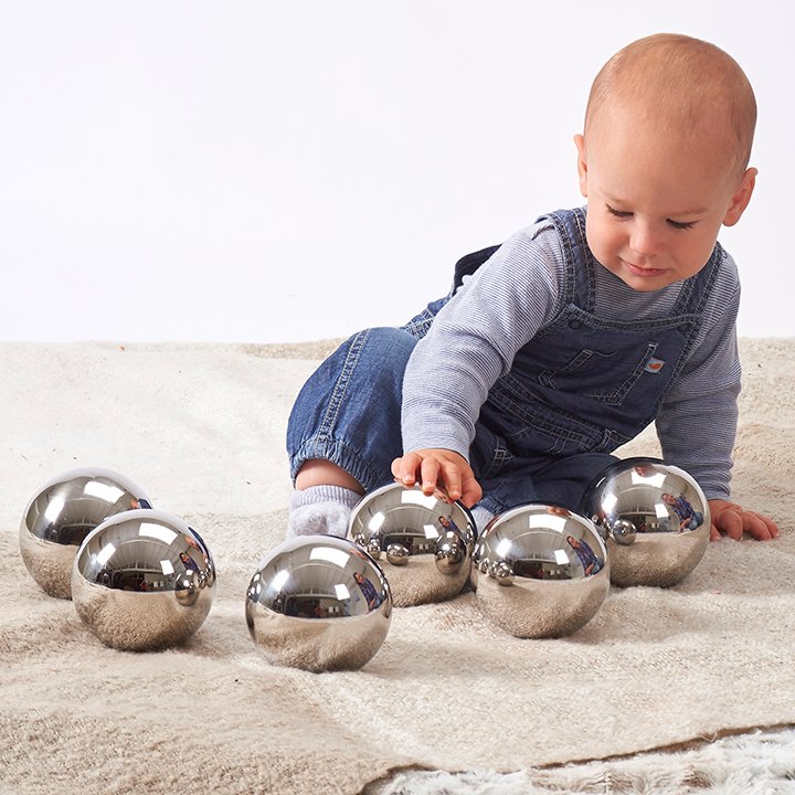 Baby playing with sensory balls