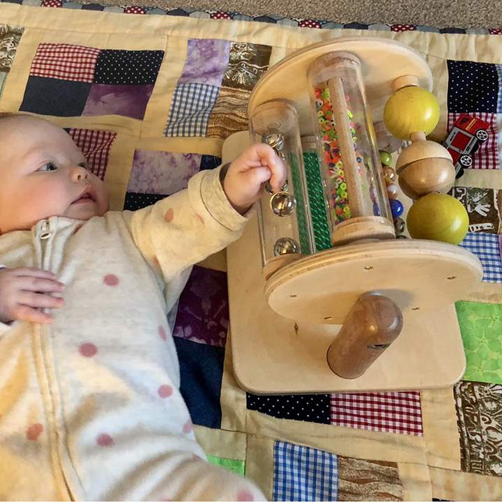 Baby toy with spinning sensory effects