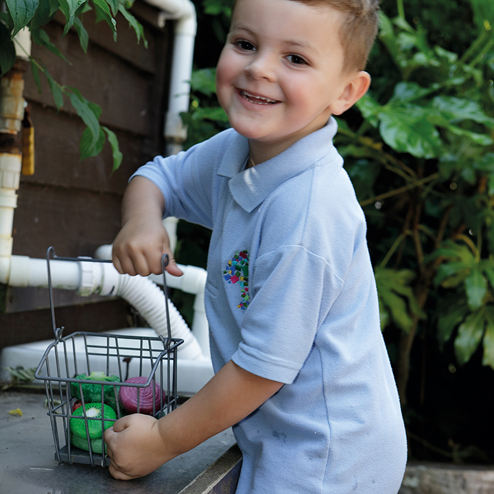 Happy child with play veg