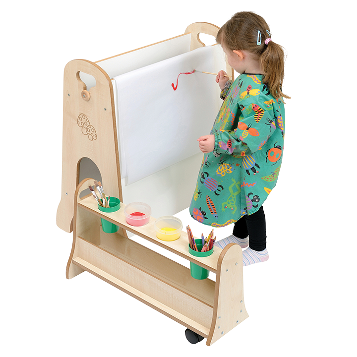 Little girl painting on whiteboard