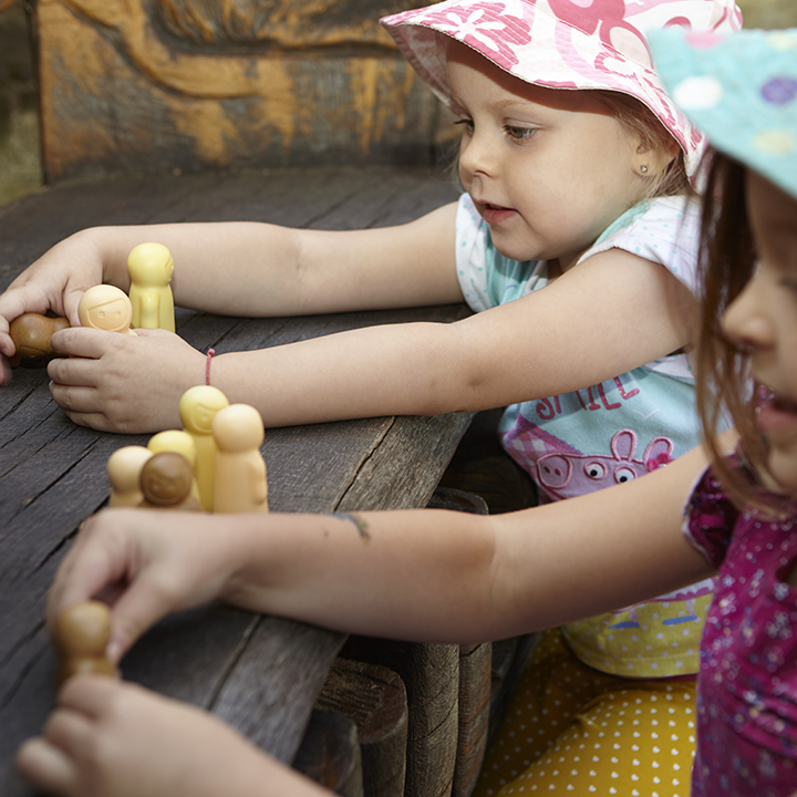 Children playing with little people toys