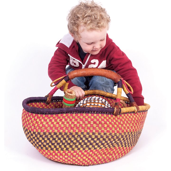 Little boy looking inside basket