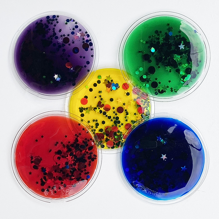 Five liquid filled circles with fascinating stars and shapes inside