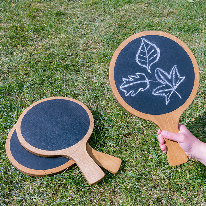 Three circular chalk boards with handles
