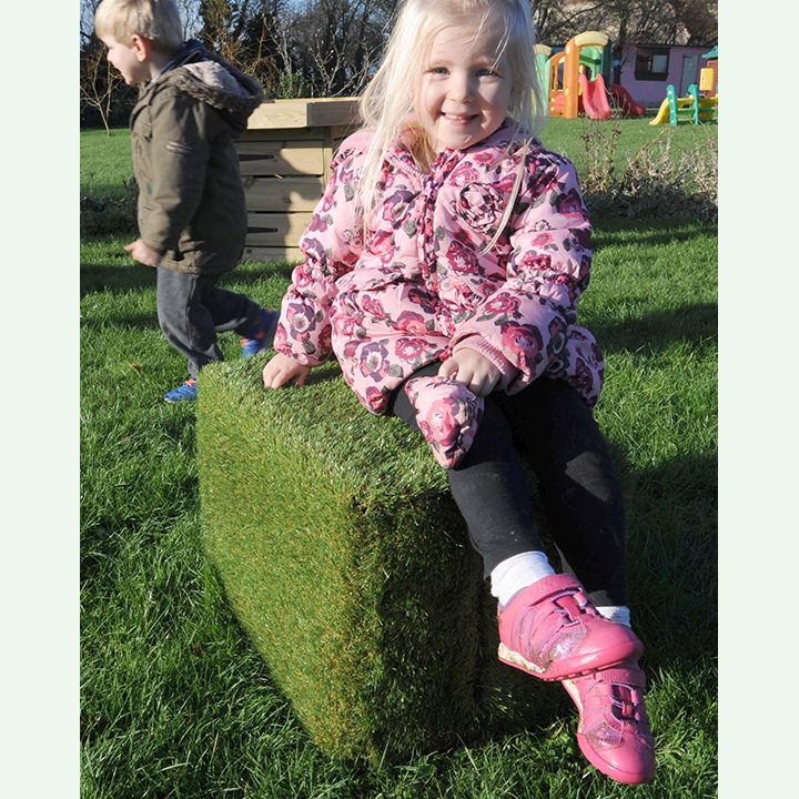 Lightweight grass seat in an outdoor setting