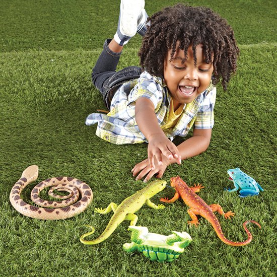 Little boy playing with Jumbo Reptiles