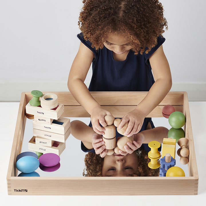 Child playing with Wooden tray with acrylic mirrored base