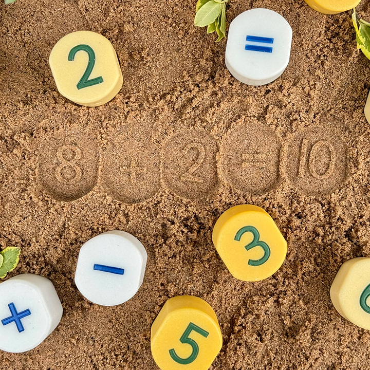 Numbers stamped into sand