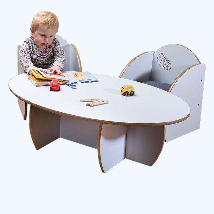 Child playing with white finish table and chairs