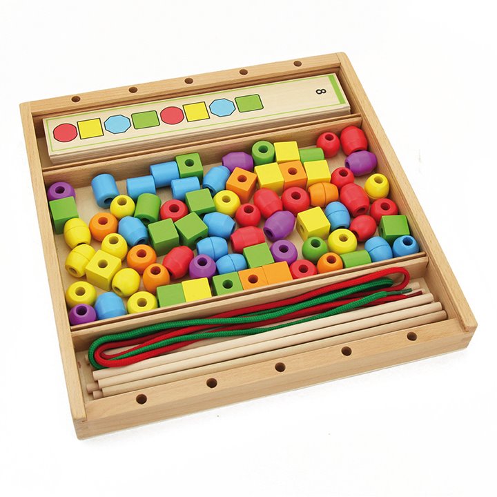 Beads, sequence boards and laces in a storage box