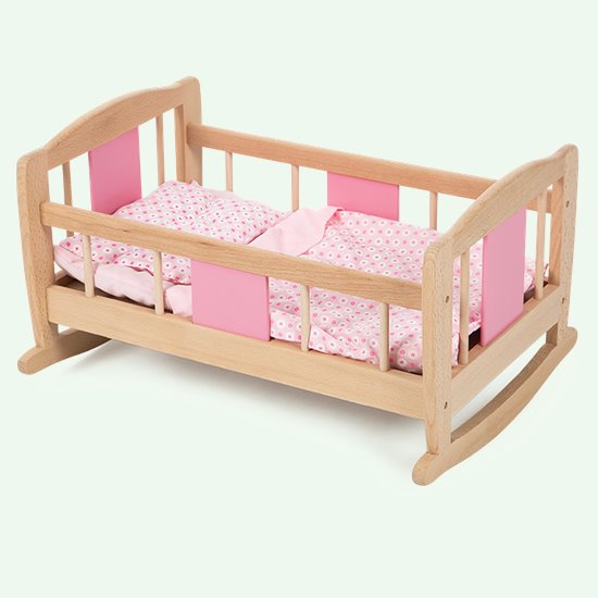Wooden rocking cradle and matching bedding