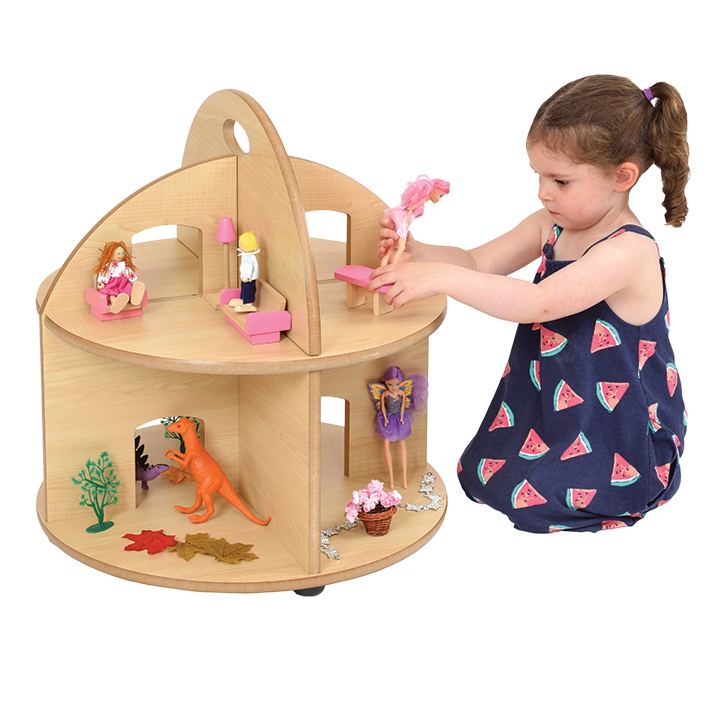 Child and wooden dolls house
