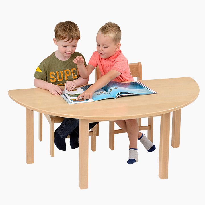 Two children at Crescent shape solid wood table