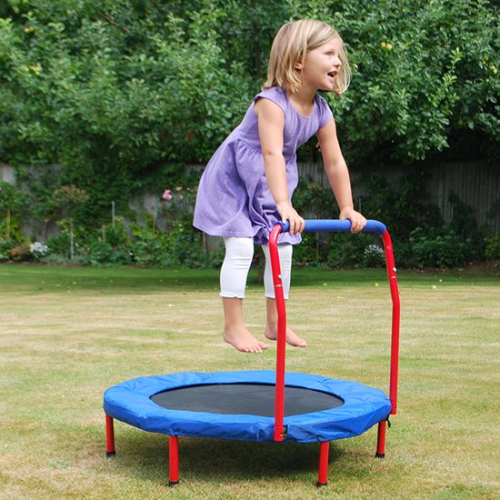 Little girl bouncing on mini trampoline