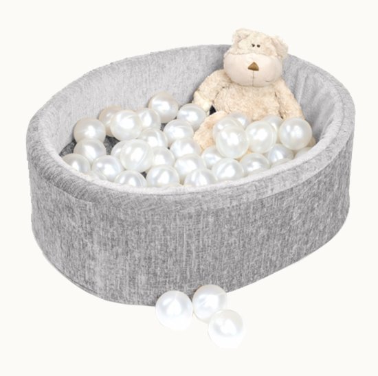 Grey snuggly den with a teddy bear and plastic balls