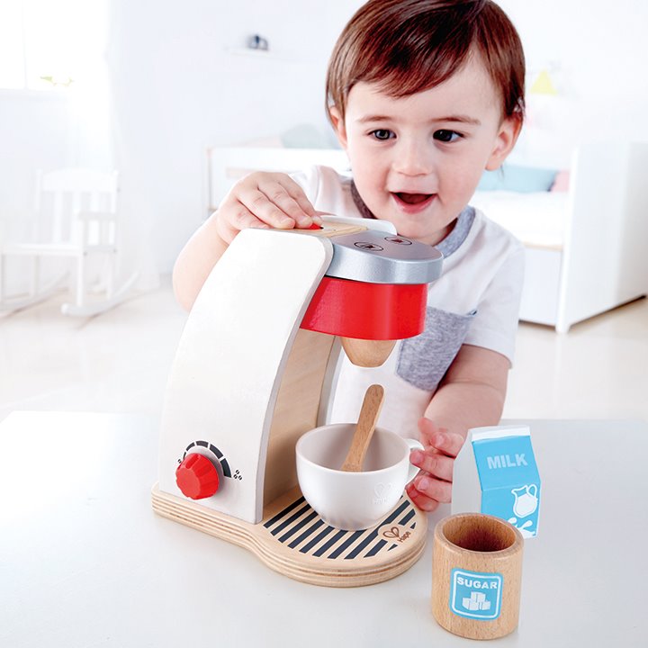 Child using a wooden mixer