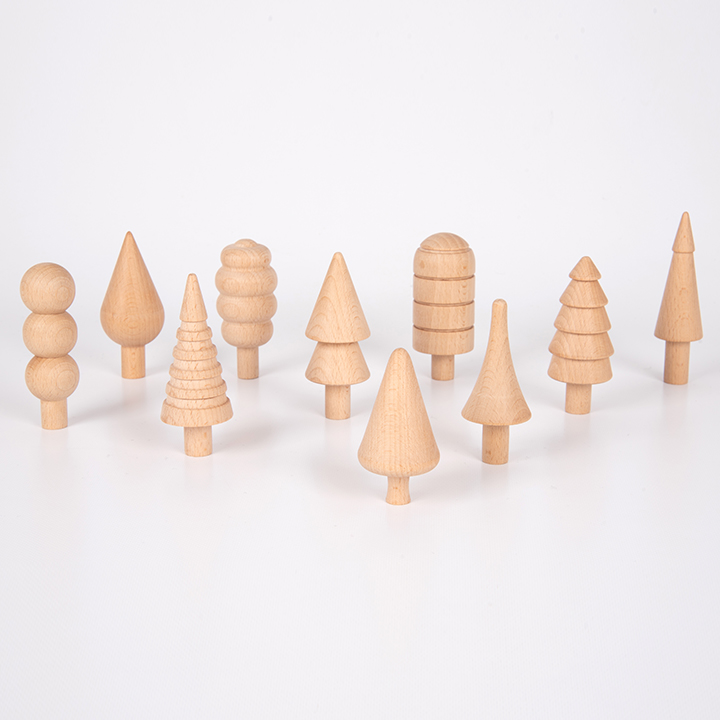 Wooden trees in different shapes and sizes stood next to one another