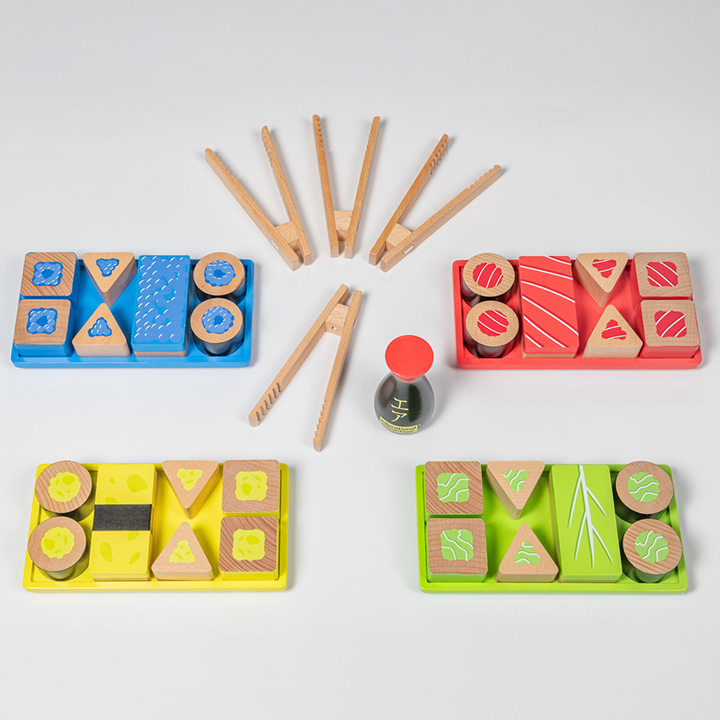 Wooden play sushi and tweezers