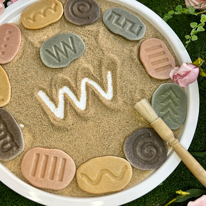 Copy the shapes on the stones in sand