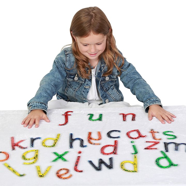 Girl with Set of tactile letters filled with glittery gel