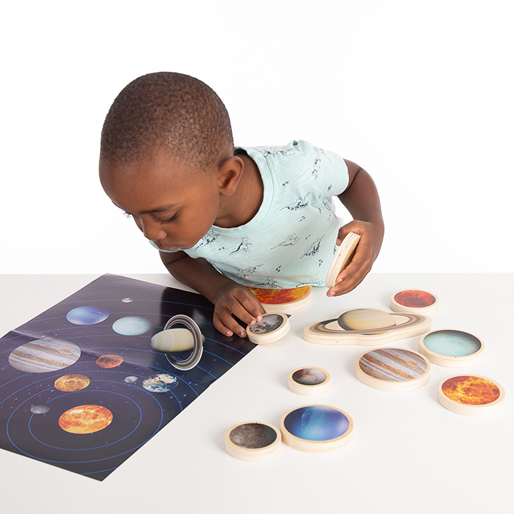 Planet poster and wooden discs