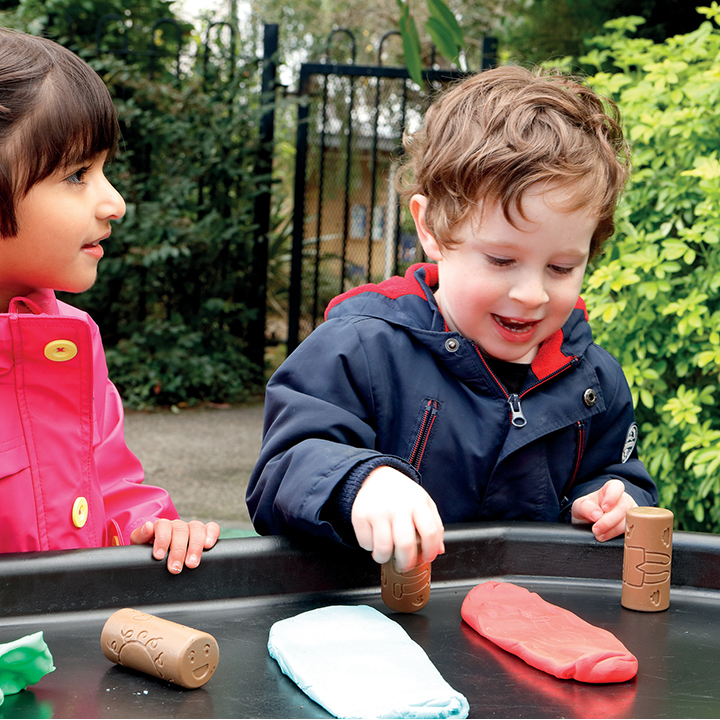 Rollers making marks in clay