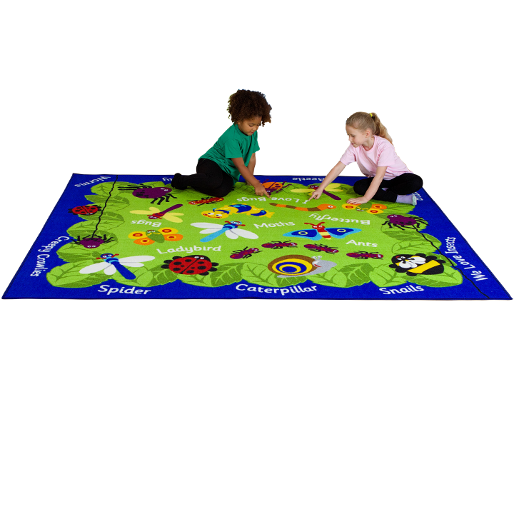 Children sat on and identifying species on mini beasts carpet