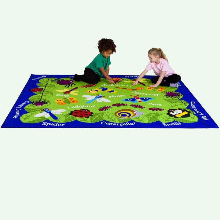 Children sat on and identifying species on mini beasts carpet