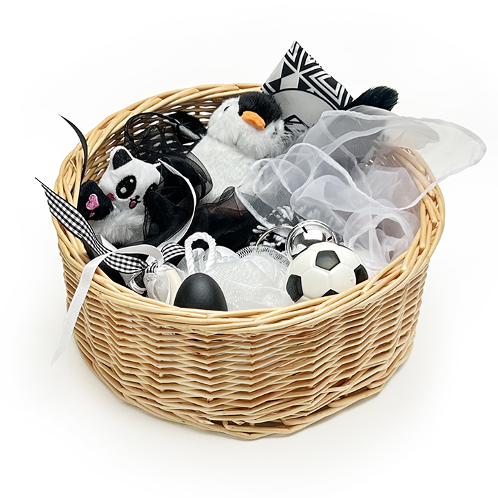 Black and white items to explore in a wicker basket