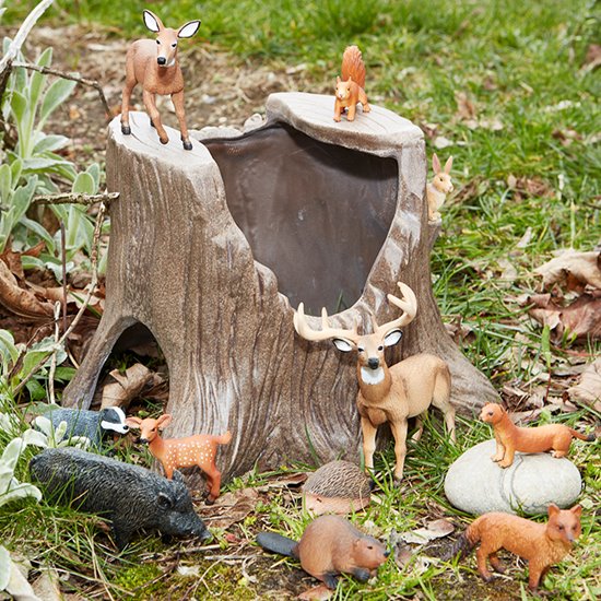 Tree stump set up with model play woodland animals