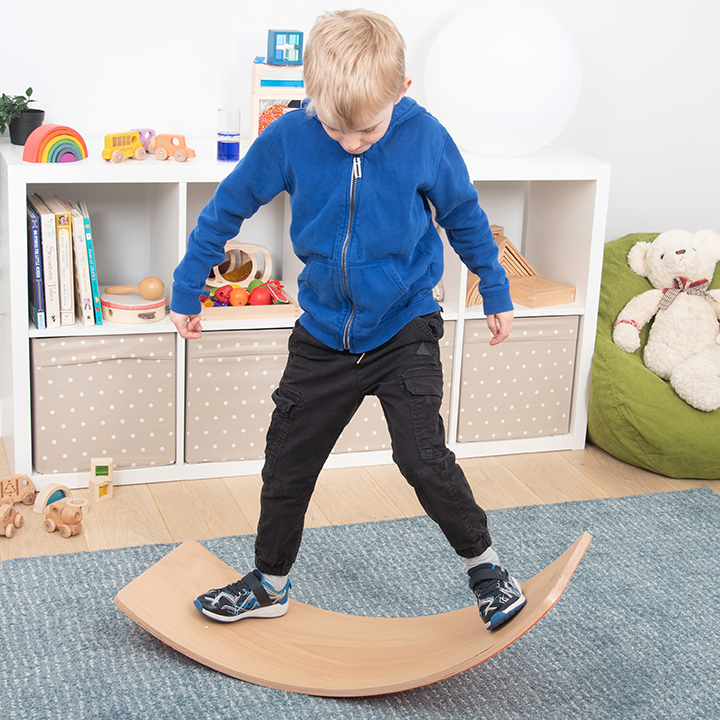 Curved board for rocking