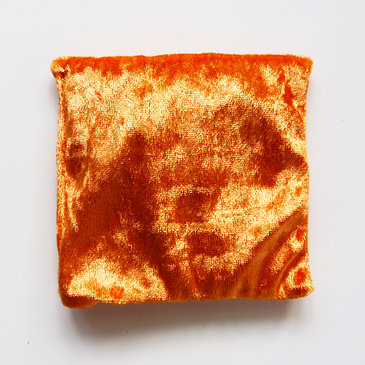 Orange velvet cushion